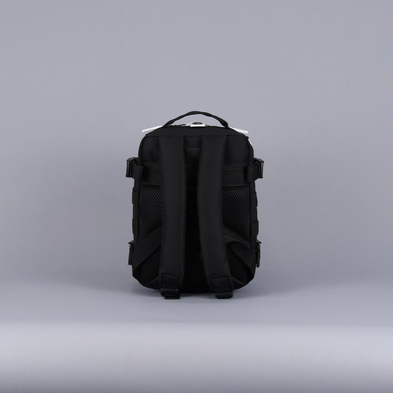 Sac à dos Mini Alpha 9L avec accents noirs et blancs